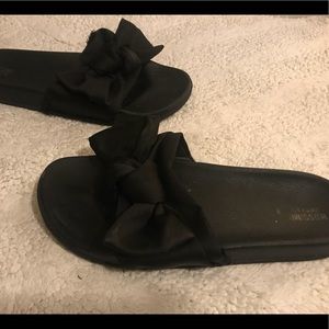 Black bow slip ons